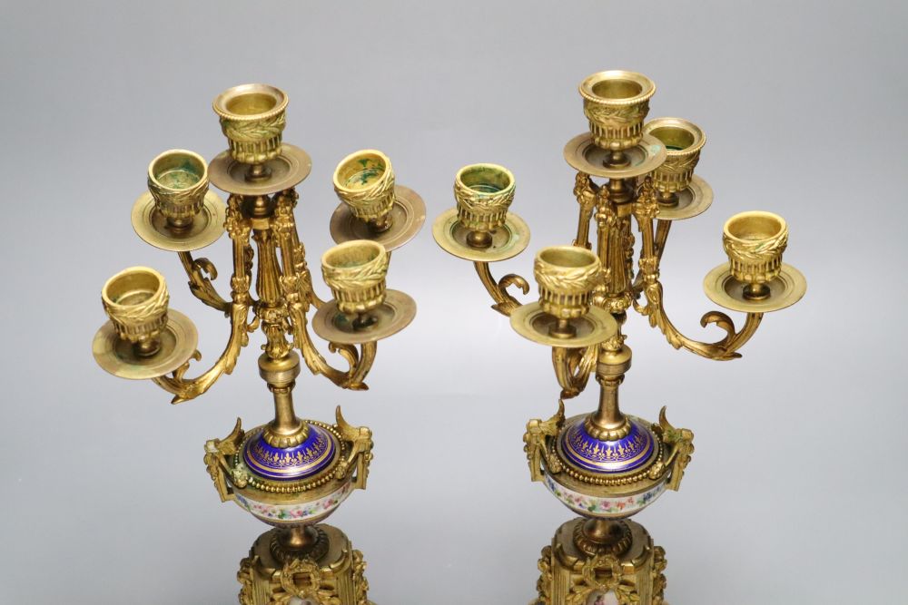 A pair of 19th century French ormulu and porcelain five light candelabra, mounts in the style of Sevres, 38cm